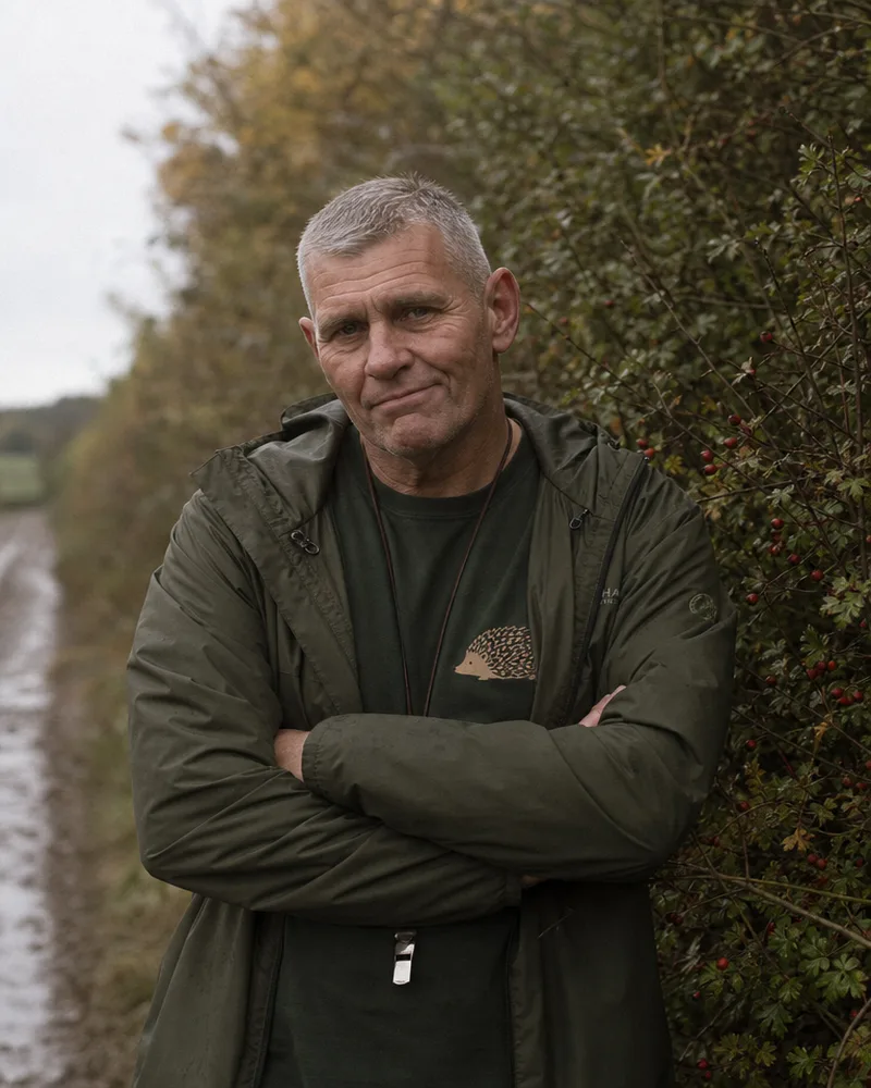 Sarge, a man in his fifties in a walking jacket, arms folded.